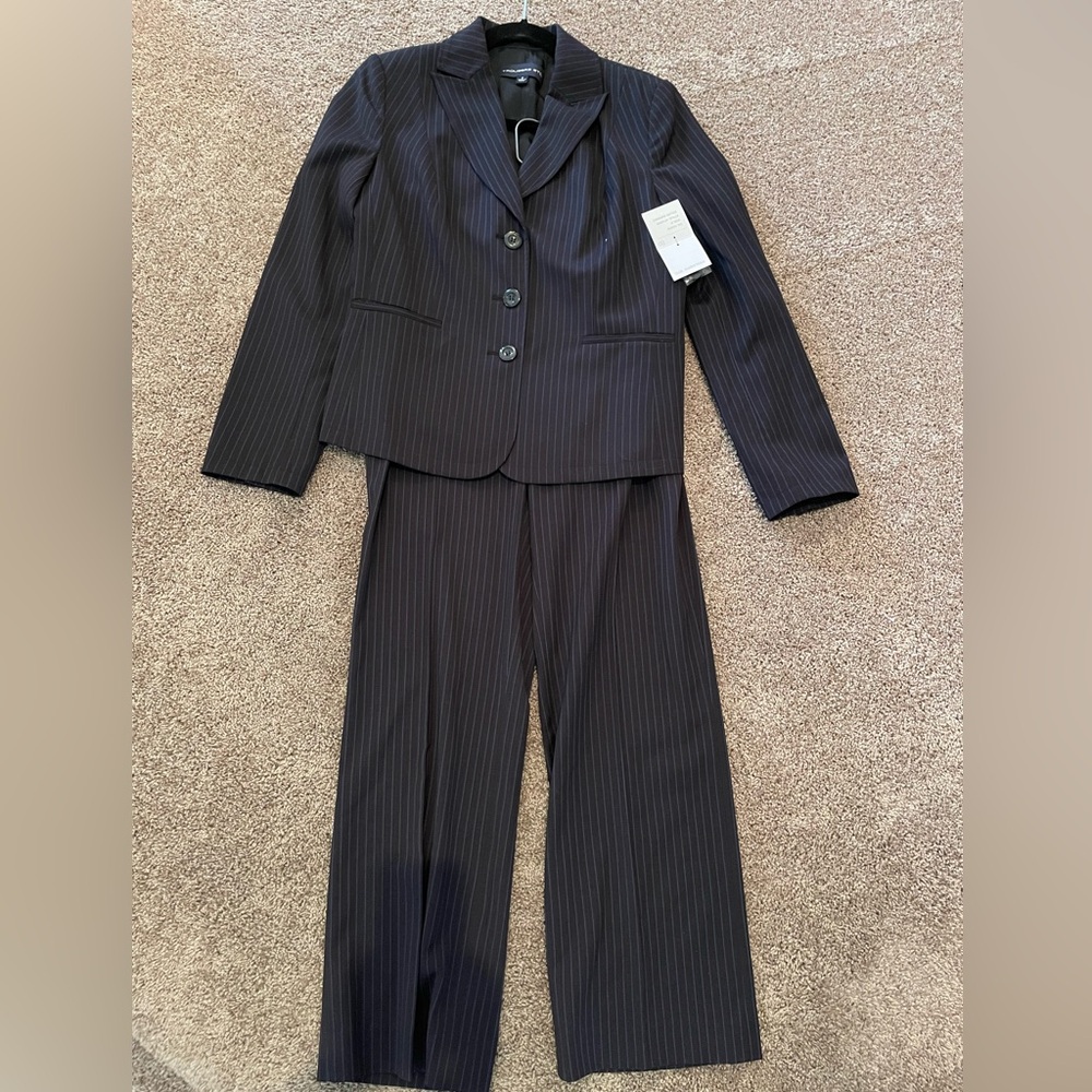 Traditional black with blue pinstripe two piece pant suit. NWT size 6